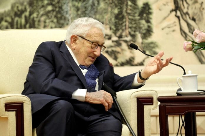 FILE PHOTO: ormer U.S. Secretary of State Henry Kissinger speaks during a meeting with Chinese Foreign Minister Wang Yi in Beijing