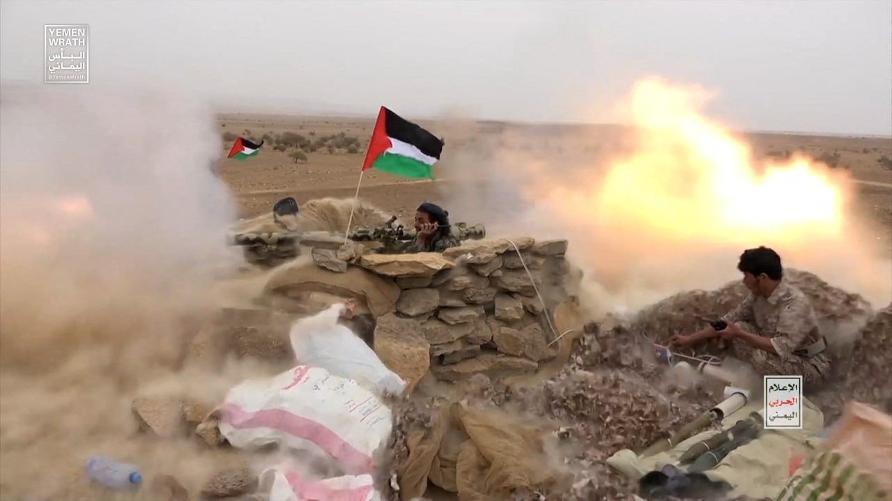 Houthi fighters fire anti-tank grenades during a military manoeuvre near Sanaa